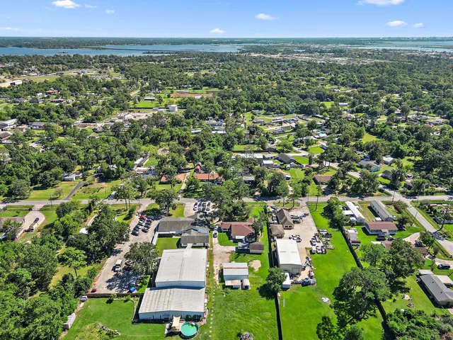 an aerial view of residential houses with outdoor space