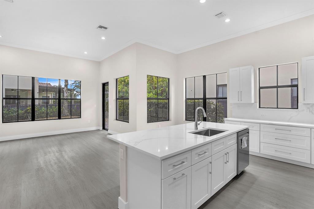 8504 Northwest 37th Court Pembroke Pines, FL 33024 - Photo 13 of 32 a kitchen with sink and mirror