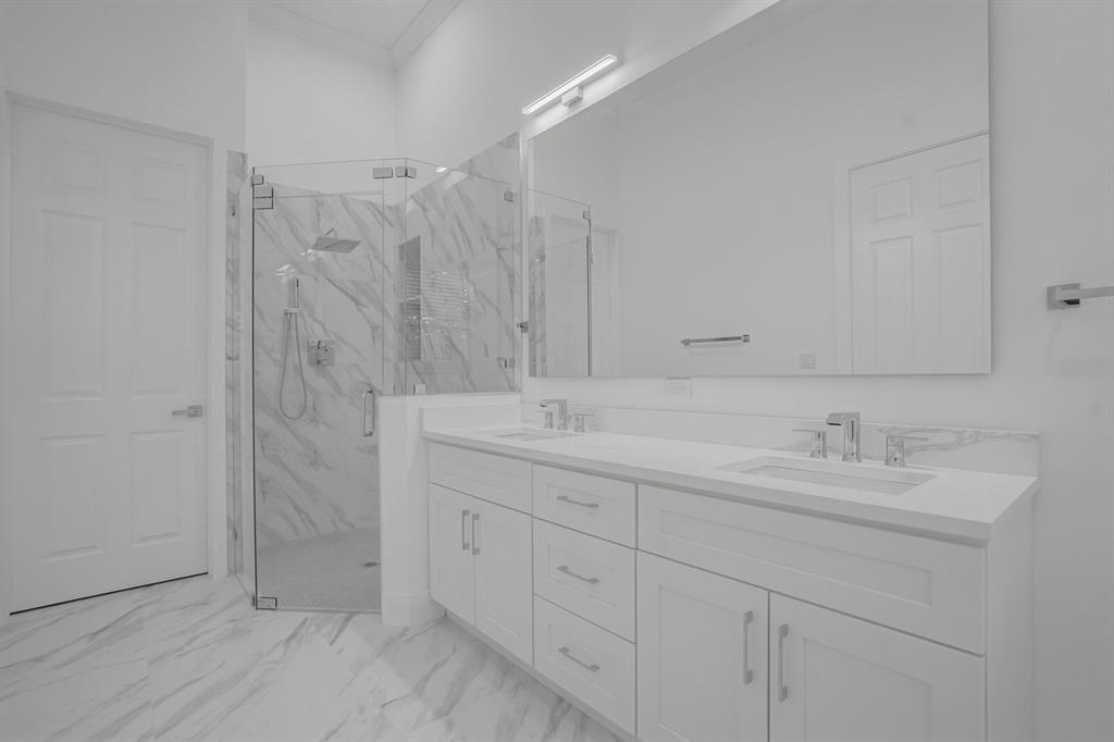 8504 Northwest 37th Court Pembroke Pines, FL 33024 - Photo 16 of 32 a bathroom with double sink and a mirror