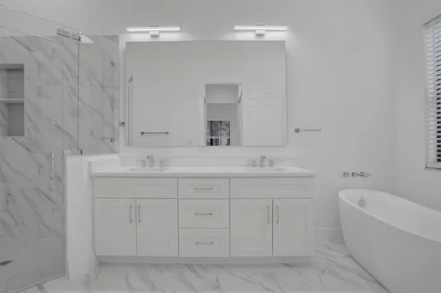 a bathroom with a sink a toilet and a bathtub