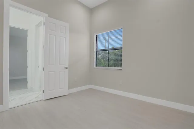 an empty room with windows