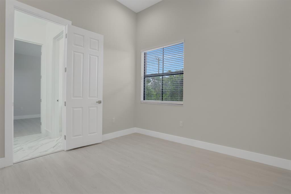 8504 Northwest 37th Court Pembroke Pines, FL 33024 - Photo 21 of 32 an empty room with windows