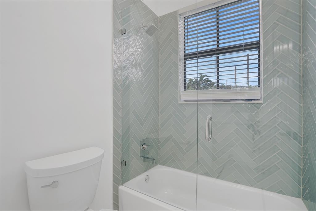 8504 Northwest 37th Court Pembroke Pines, FL 33024 - Photo 23 of 32 a bathroom with a shower and a sink