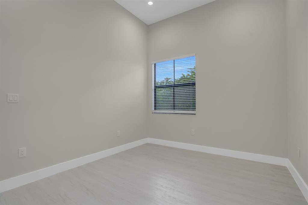 8504 Northwest 37th Court Pembroke Pines, FL 33024 - Photo 24 of 32 an empty room with a empty space and windows