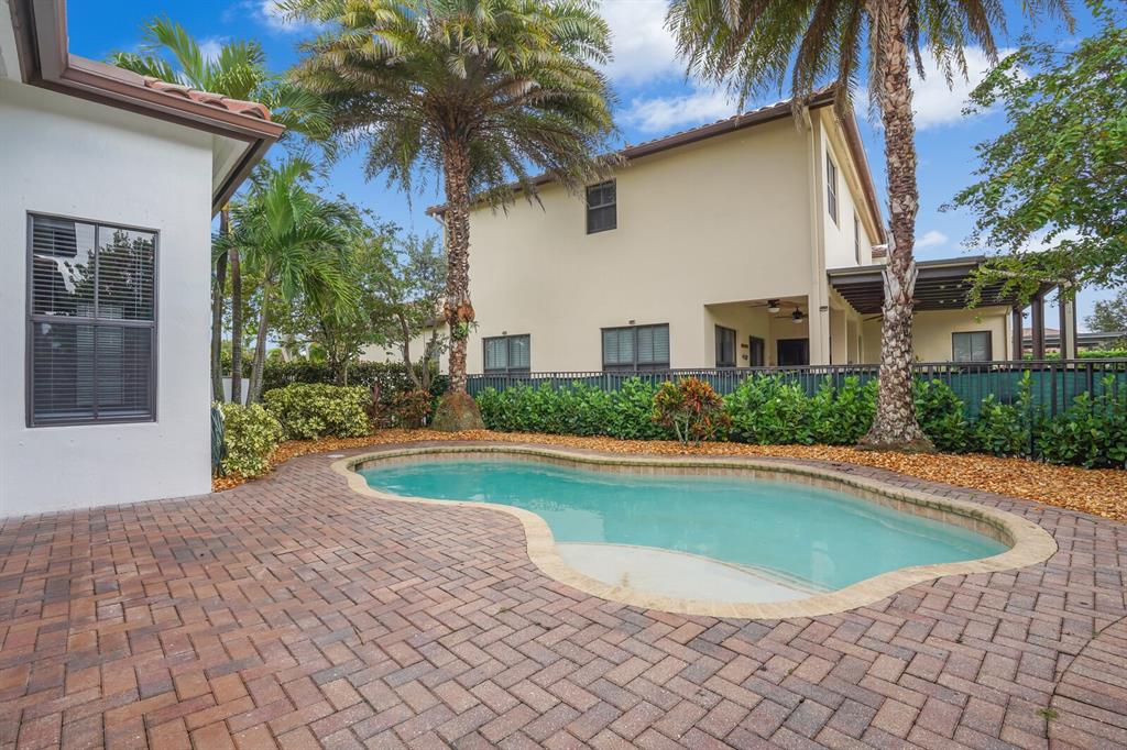 8504 Northwest 37th Court Pembroke Pines, FL 33024 - Photo 29 of 32 a view of a house with a swimming pool