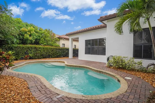 a view of swimming pool with outdoor seating