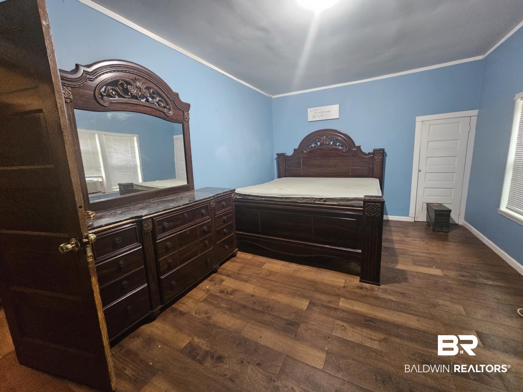 31398 Brady Road Robertsdale, AL 36567 - Photo 17 of 17 Bedroom with ornamental molding, dark wood finished floors, and baseboards
