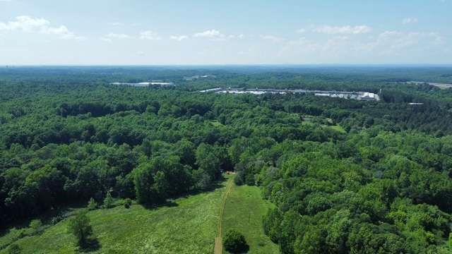 606 Beck Road Commerce, GA 30529 - Photo 8 of 10 an aerial view of residential houses with outdoor space and trees