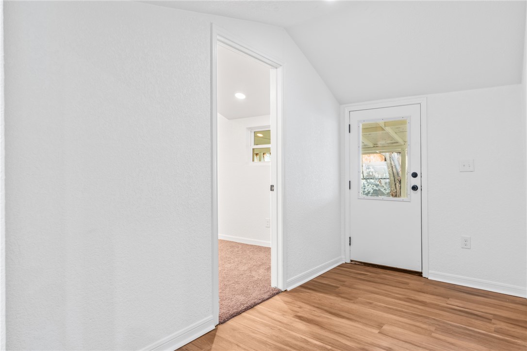 809 East Downs Avenue Temple, TX 76501 - Photo 22 of 24 an empty room with wooden floor and windows