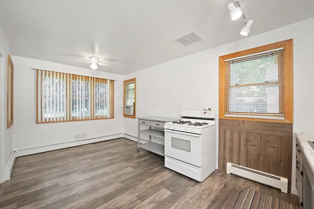 a kitchen with a stove oven and sink