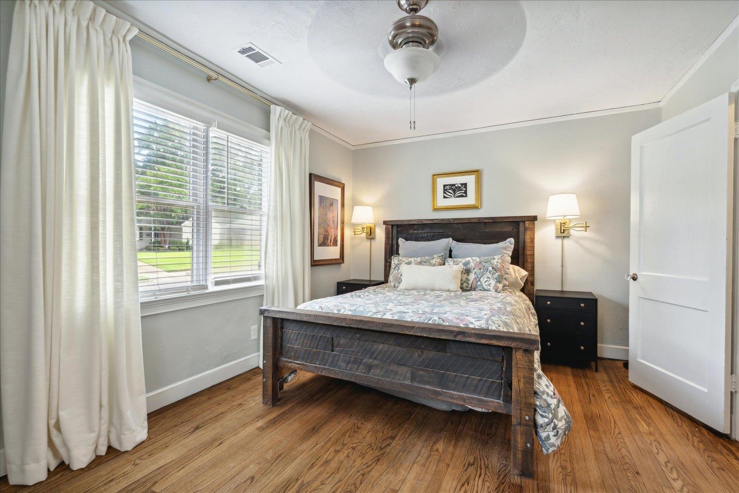 3569 Aurora Circle Memphis, TN 38111 - Photo 18 of 23 a bedroom with a bed and wooden floor