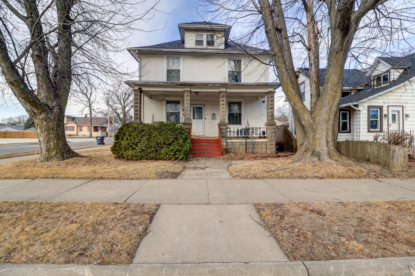 700 North 3rd Street Clinton, IA 52732 - Photo 1 of 30 a front view of a house with garden and seating