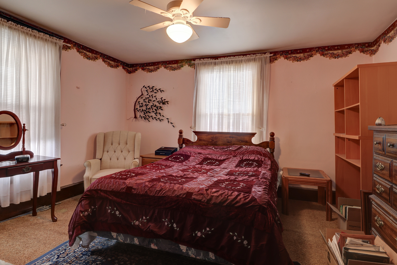 700 North 3rd Street Clinton, IA 52732 - Photo 12 of 30 a bedroom with a bed and a chandelier