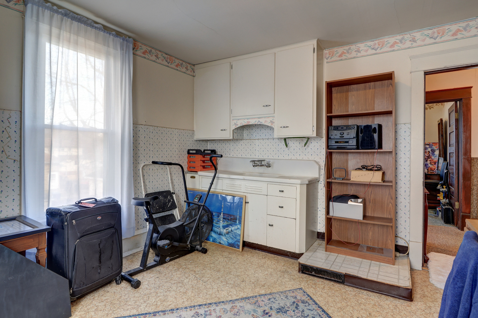 700 North 3rd Street Clinton, IA 52732 - Photo 14 of 30 a bed room with a bed and a window