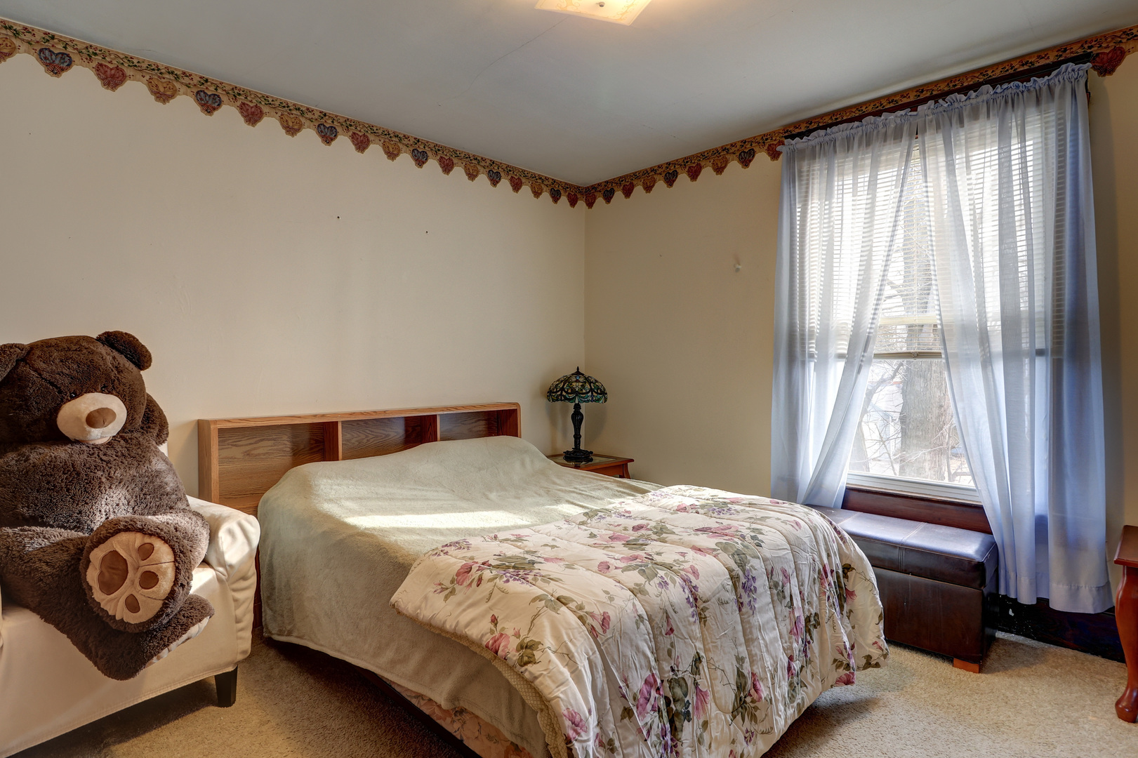 700 North 3rd Street Clinton, IA 52732 - Photo 16 of 30 a bedroom with a bed and a window