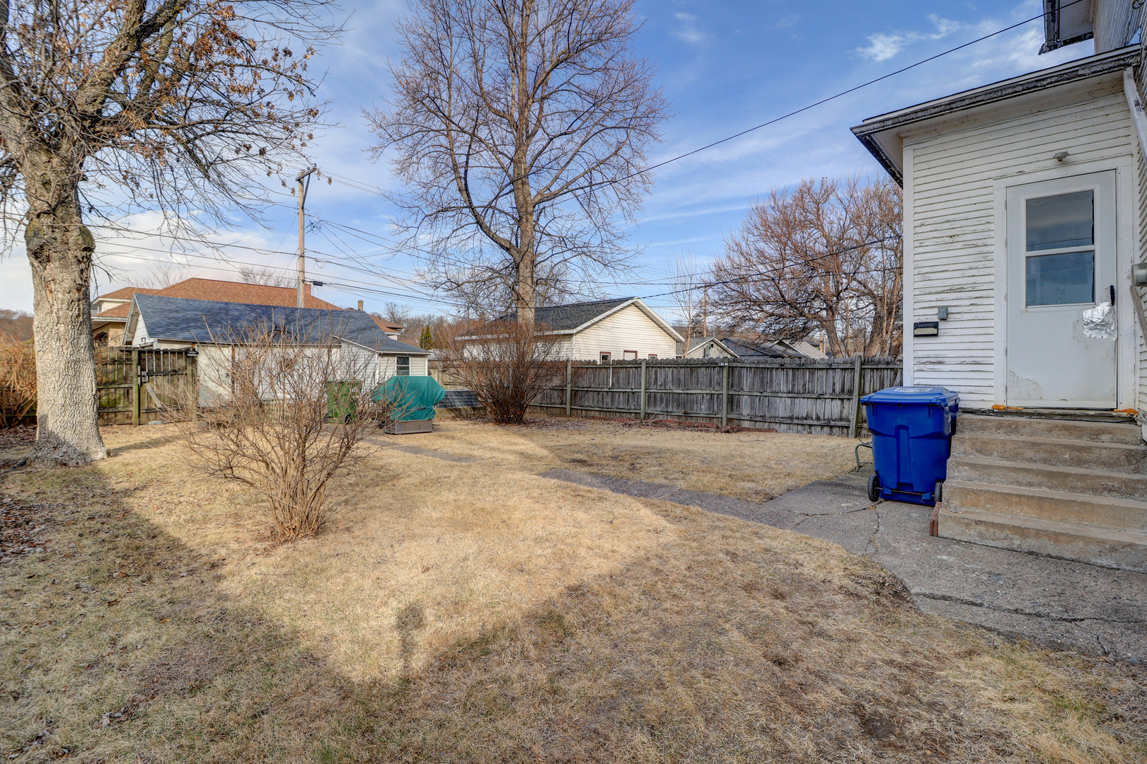 700 North 3rd Street Clinton, IA 52732 - Photo 22 of 30 a view of a backyard with wooden fence