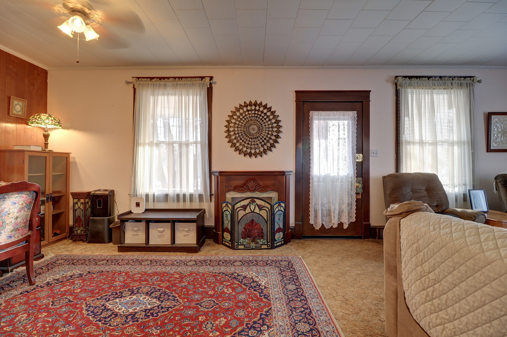 700 North 3rd Street Clinton, IA 52732 - Photo 4 of 30 a bedroom with furniture and a fireplace