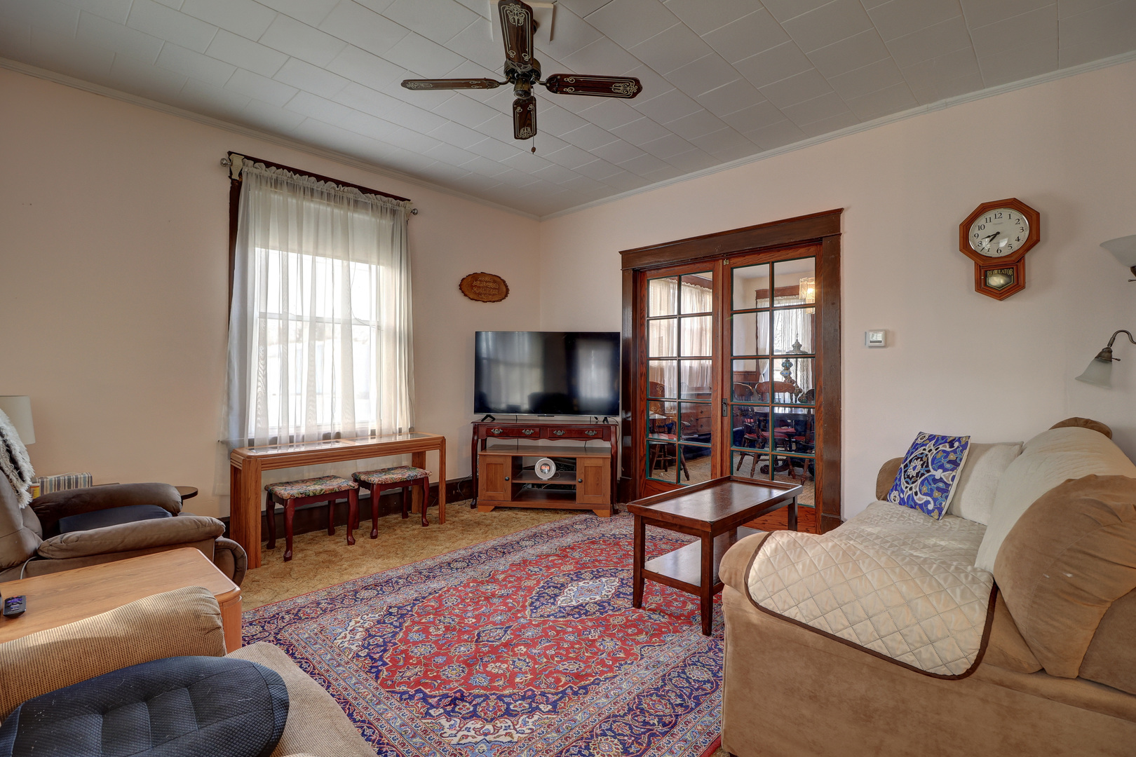 700 North 3rd Street Clinton, IA 52732 - Photo 5 of 30 a living room with furniture and a flat screen tv