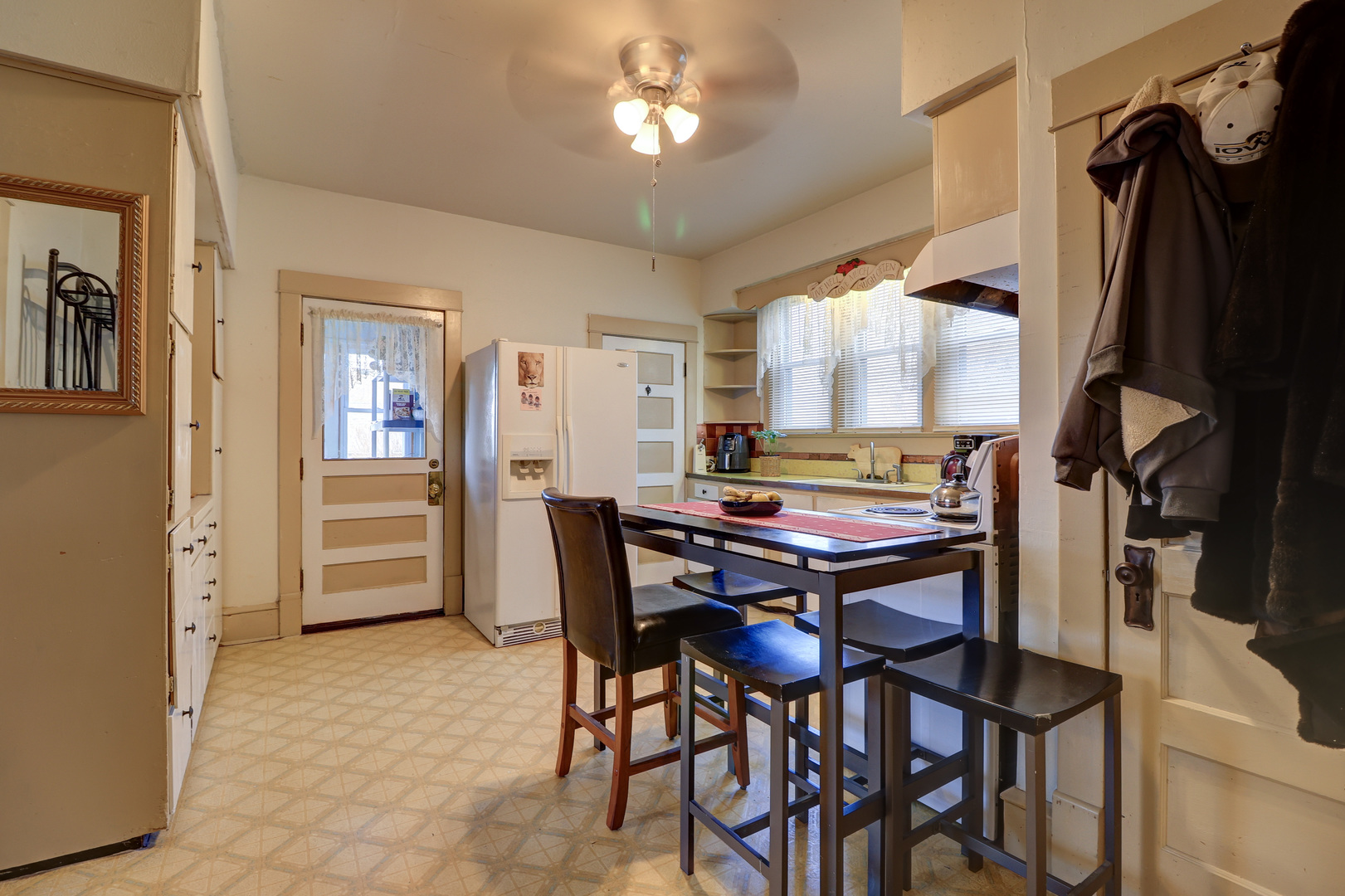 700 North 3rd Street Clinton, IA 52732 - Photo 6 of 30 a view of a dining room with furniture and a chandelier