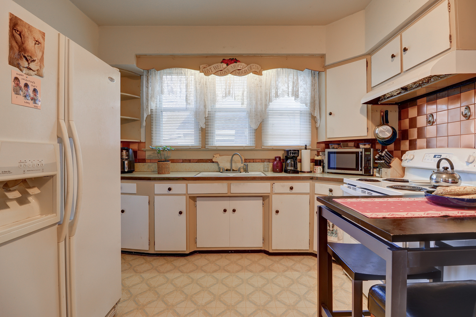 700 North 3rd Street Clinton, IA 52732 - Photo 7 of 30 a kitchen with stainless steel appliances granite countertop a sink stove and cabinets