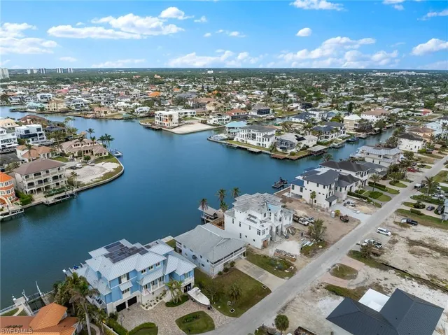 an aerial view of a residential houses with outdoor space