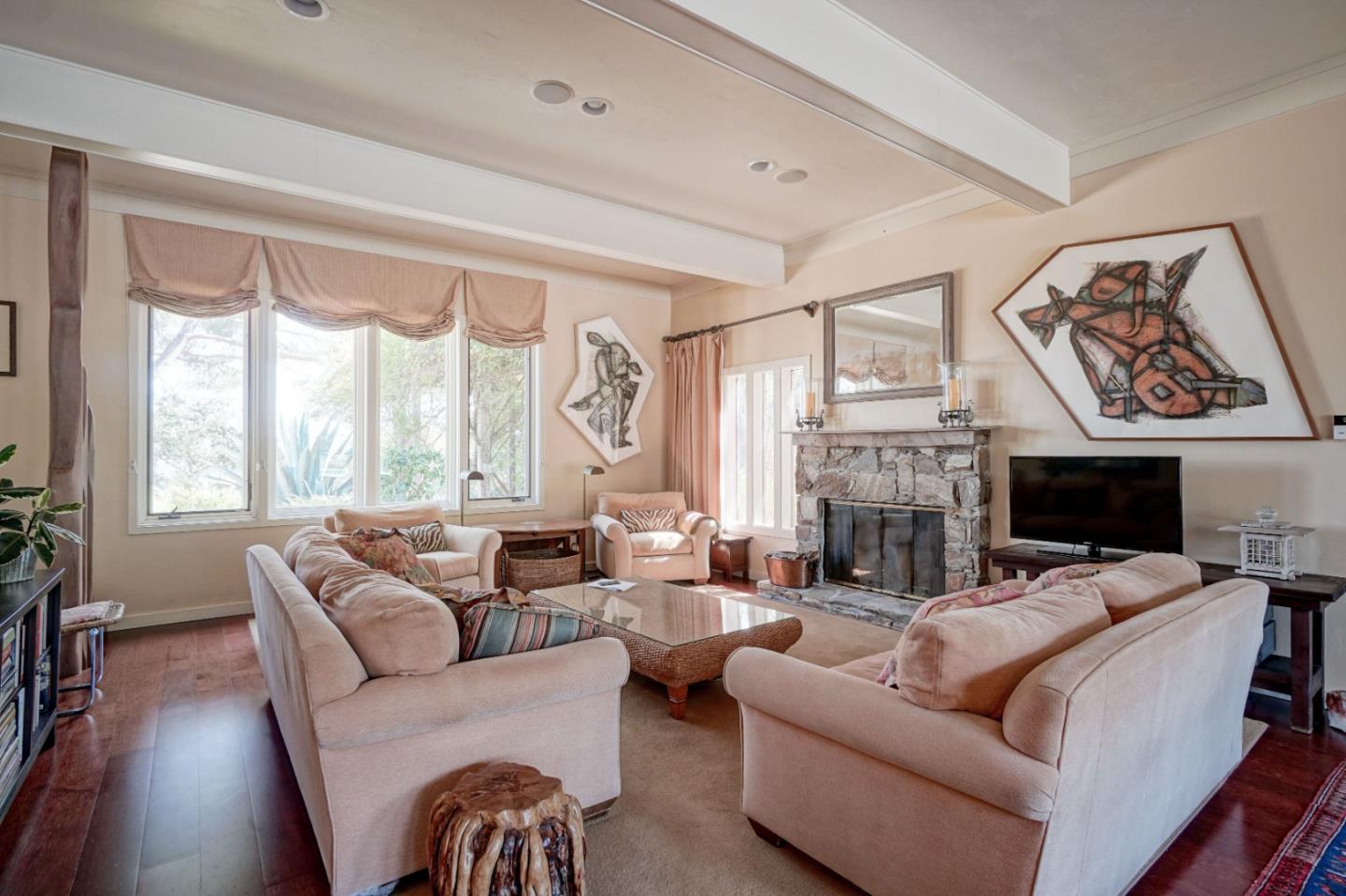 278 Corral De Tierra Road Salinas, CA 93908 - Photo 9 of 38 a living room with furniture a fireplace and a large window