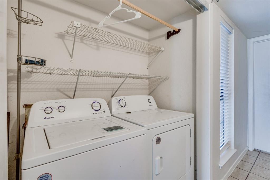 4606 Chaha Road, Unit 105 Garland, TX 75043 - Photo 16 of 26 Laundry area featuring light tile patterned floors and independent washer and dryer