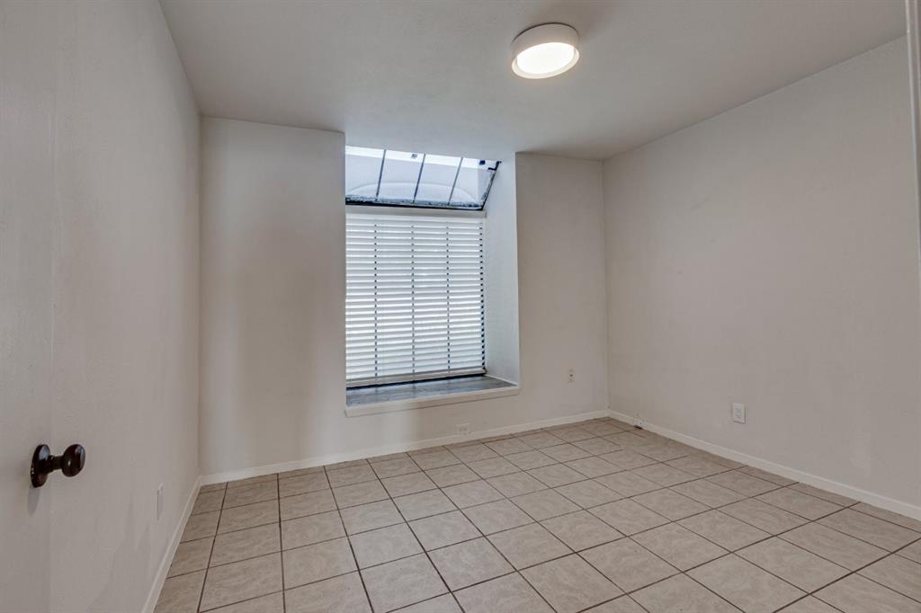 4606 Chaha Road, Unit 105 Garland, TX 75043 - Photo 17 of 26 Unfurnished room with light tile patterned floors and baseboards