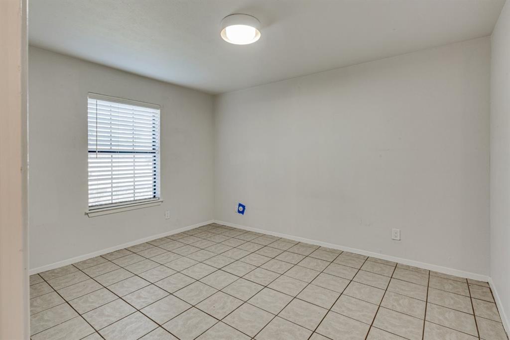 4606 Chaha Road, Unit 105 Garland, TX 75043 - Photo 19 of 26 Unfurnished room with baseboards and light tile patterned floors