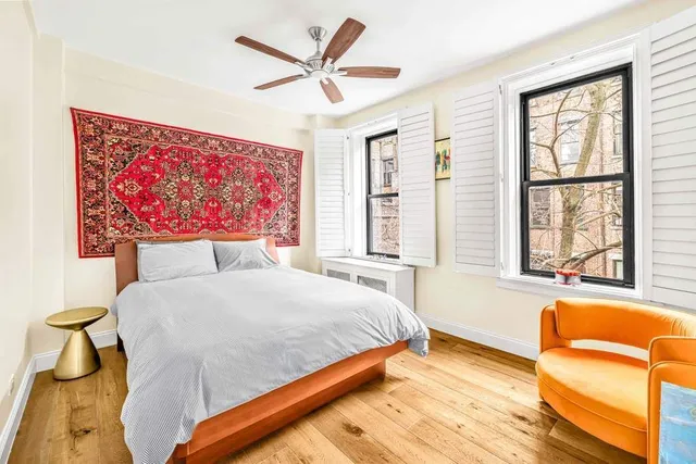 a bedroom with a bed and a couch