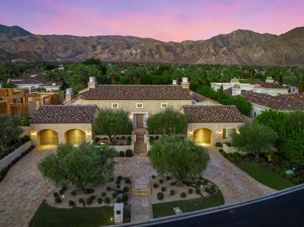 an aerial view of a house with a garden