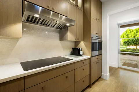 a kitchen with kitchen island a counter space a sink and appliances