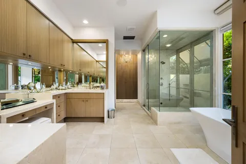 a large bathroom with a large tub and shower