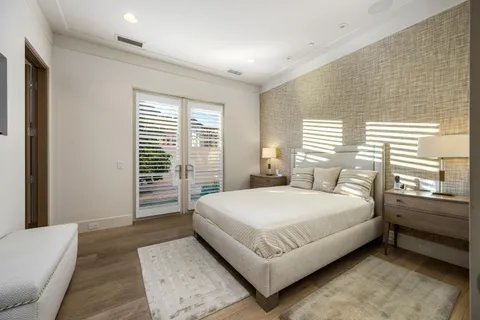 a bedroom with a large bed and a couch