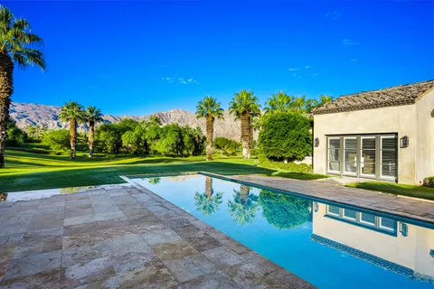 a view of a house with a swimming pool