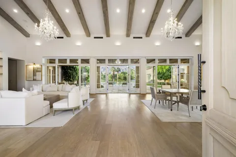 a lobby with furniture and large windows