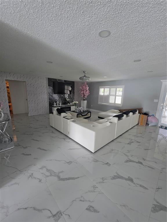 4821 Platt Road Plant City, FL 33565 - Photo 15 of 49 a living room with furniture and a fireplace