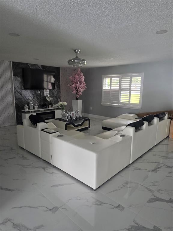 4821 Platt Road Plant City, FL 33565 - Photo 4 of 49 a kitchen with stainless steel appliances a sink a stove a microwave and cabinets