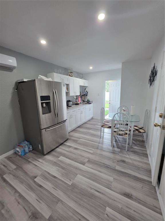 4821 Platt Road Plant City, FL 33565 - Photo 45 of 49 a living room with furniture and wooden floor