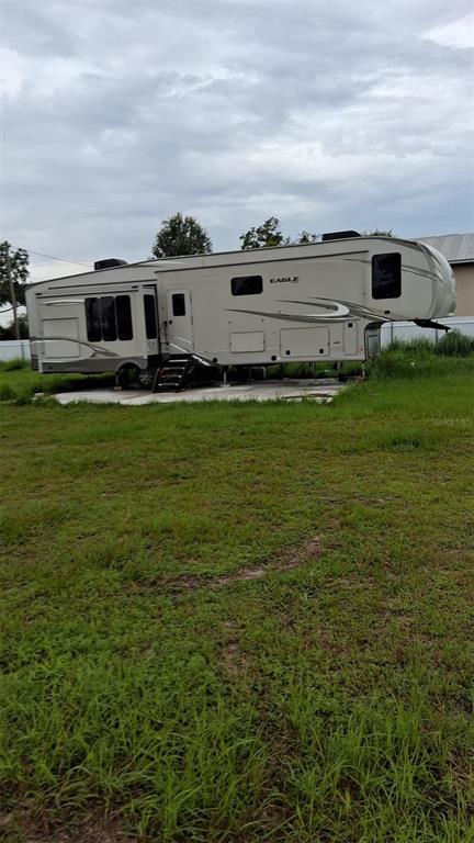 4821 Platt Road Plant City, FL 33565 - Photo 48 of 49 a view of a big yard with table and chairs