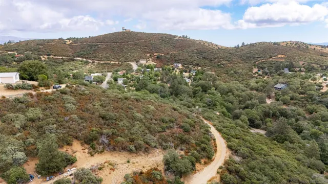 an aerial view of residential house and green space