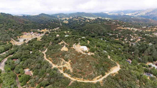 an aerial view of residential house and green space