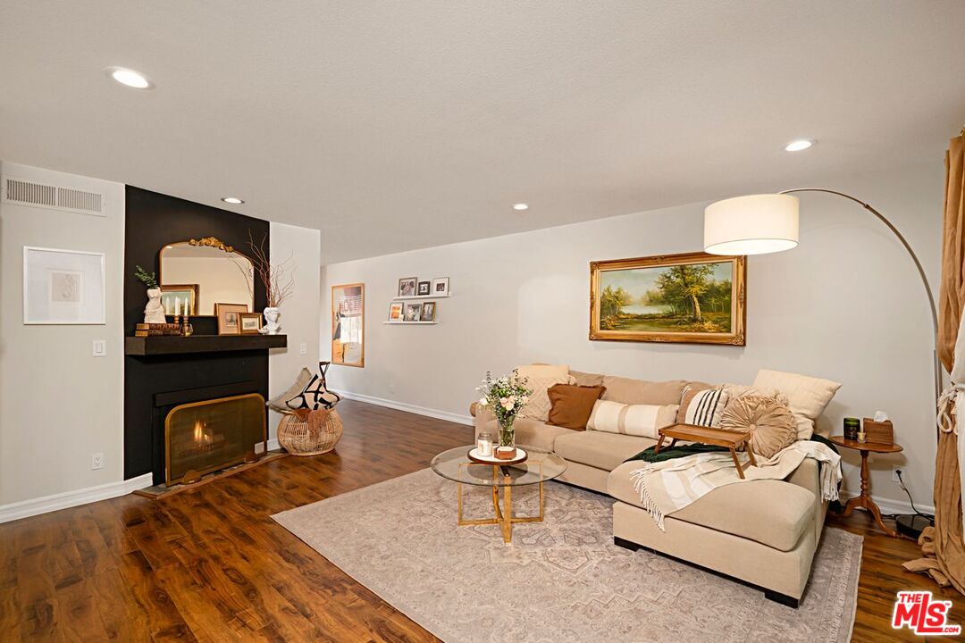 7774 Vía Rosa Maria Burbank, CA 91504 - Photo 3 of 22 a living room with furniture and a fireplace