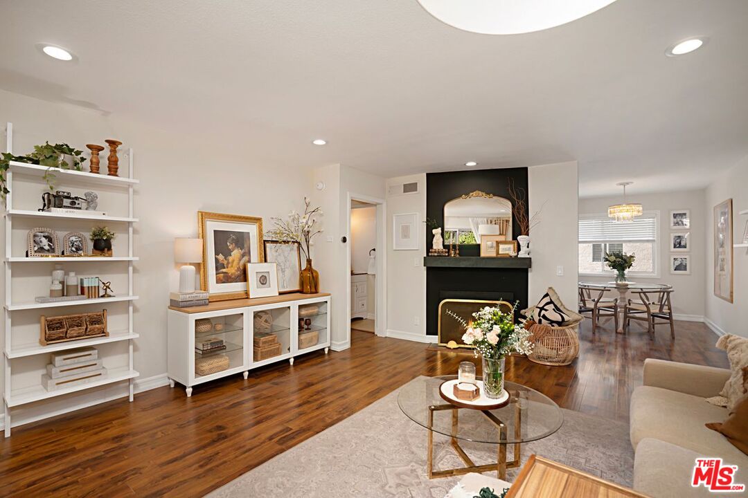 7774 Vía Rosa Maria Burbank, CA 91504 - Photo 4 of 22 a living room with furniture and a fireplace