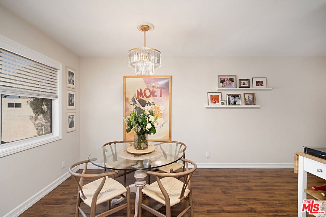 7774 Vía Rosa Maria Burbank, CA 91504 - Photo 6 of 22 a view of a dining room with furniture a chandelier and wooden floor