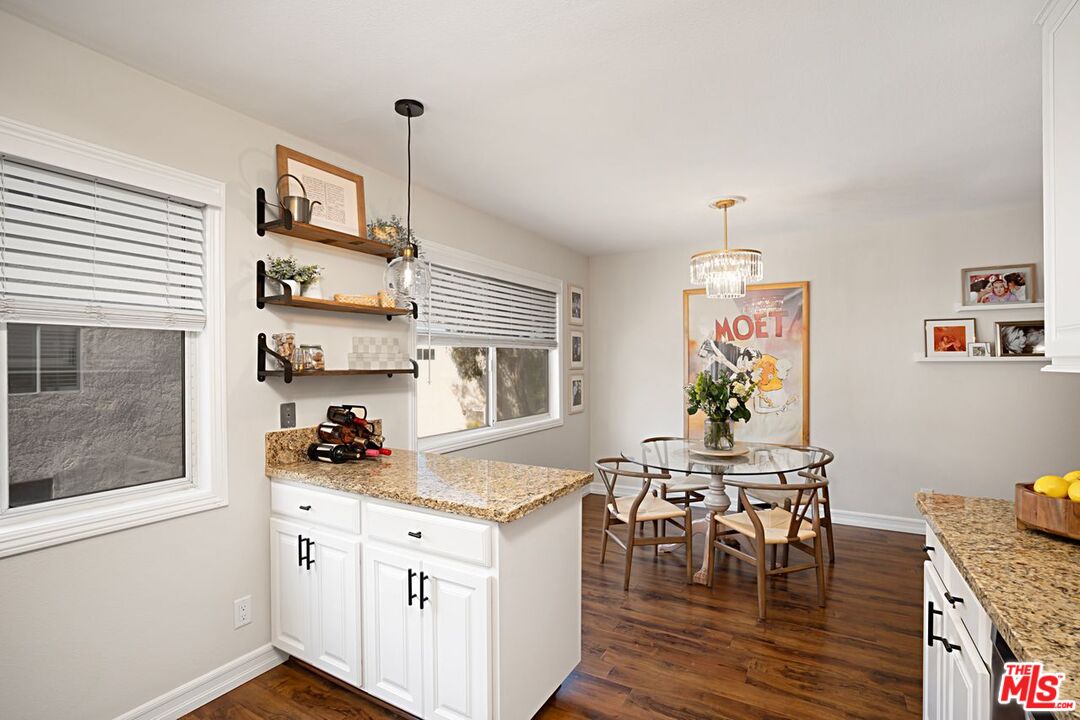 7774 Vía Rosa Maria Burbank, CA 91504 - Photo 9 of 22 a kitchen that has a cabinets counter space and a stove top oven