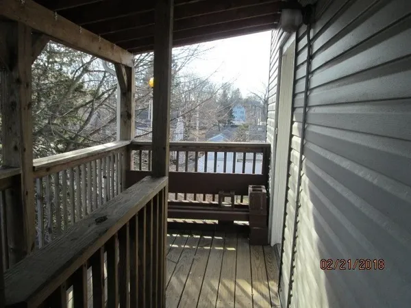 a view of a balcony with chairs