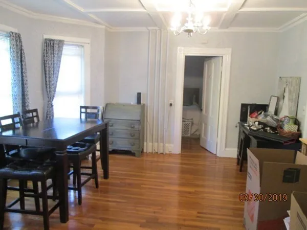 a view of a dining room with furniture and window