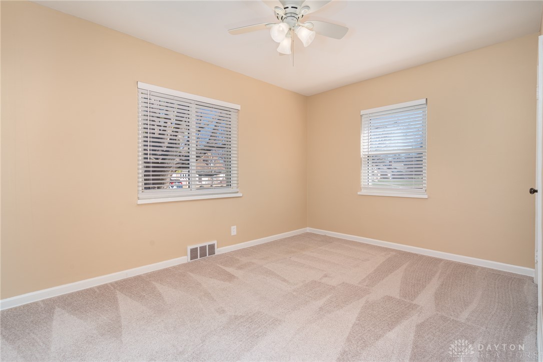 326 North Bromfield Road Kettering, OH 45429 - Photo 13 of 30 This spacious bedroom offers ample natural light and plush carpeting for comfort.