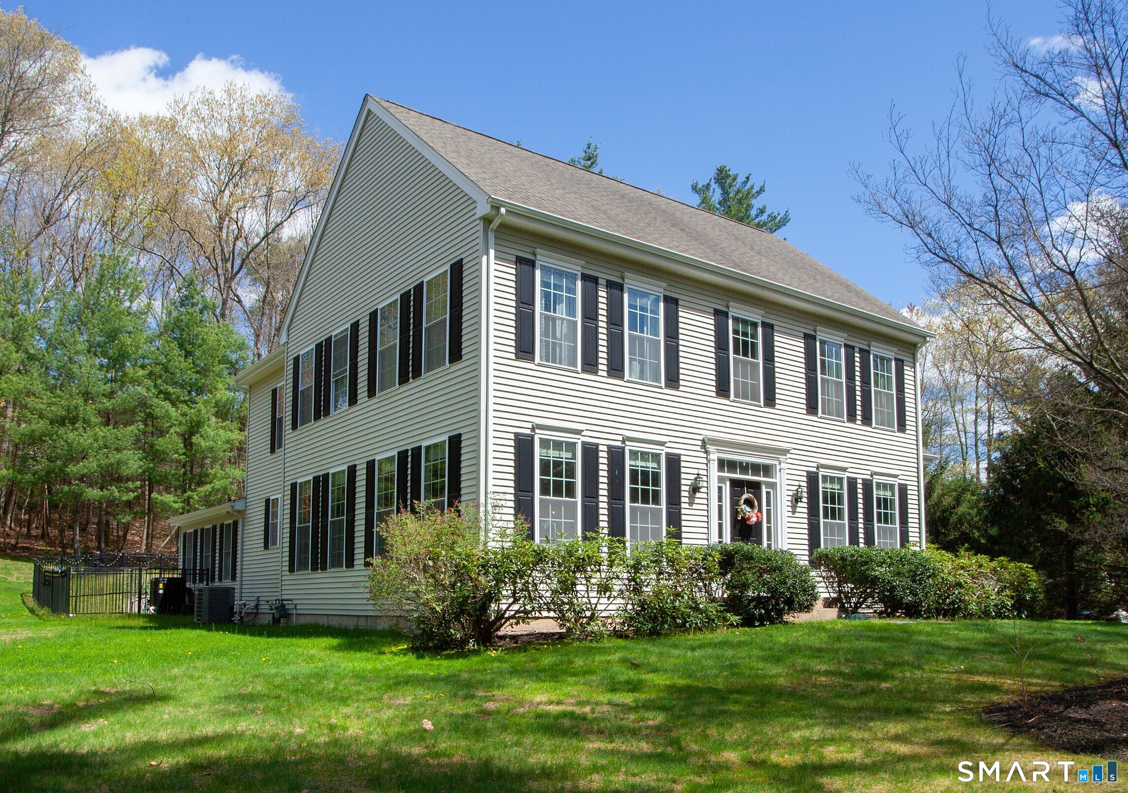 490 New Road Avon, CT 06001 - Photo 2 of 30 a front view of house with yard and green space